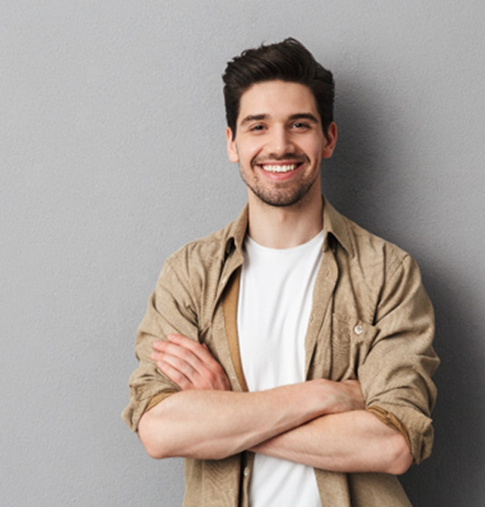 a young man smiling happily