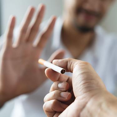 Man declining offer of cigarette